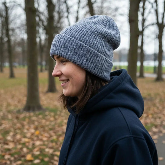 Person wearing a soft cotton blend beanie on a brisk autumn walk, demonstrating everyday comfort.